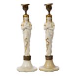 Two Parian ware figural candlesticks, 19th century, modelled as Egyptian style woman, to spreading