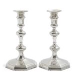 A pair of Queen Anne Britannia silver candlesticks, London, c.1709, Thomas Merry, of faceted,