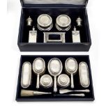 An impressive George V silver dressing table service, 1927-1932, London, Lionel Alfred Crichton,