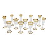A set of six Saint Louis thistle pattern champagne flutes, with elongated ribbed bell form bowls, to