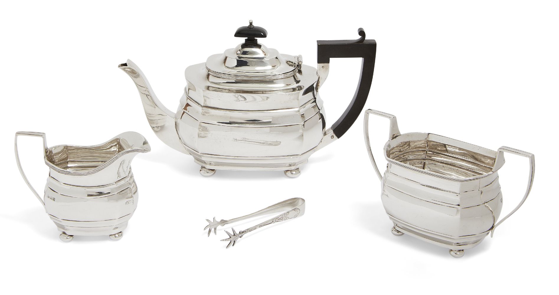 A George V three-piece silver tea set, Birmingham, c.1927, Blanckensee & Son Ltd, of rectangular