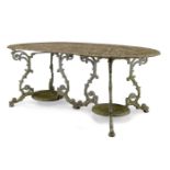 A white painted cast aluminium garden table, late 20th Century, with pierced decorative top on