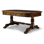 A Regency mahogany library table in the manner of Gillows, the rounded rectangular top with