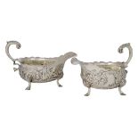 A pair of George II silver sauce boats, London, c.1748, Ann Kersill, each raised on three shell-