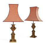 A pair of Regency style gilt-brass table lamps, first half 20th century, each urn mounted with