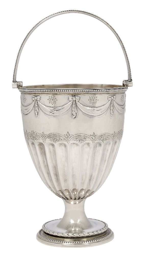 A Victorian silver swing handled cup vase, London, c.1879, James Beebe, raised on a circular