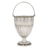 A Victorian silver swing handled cup vase, London, c.1879, James Beebe, raised on a circular