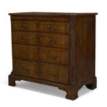 A George II walnut bachelor's chest, the quarter veneered top, above brush slide and four long...
