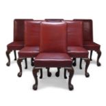 A set of six George II style leather upholstered dining chairs, early to mid 20th Century, the