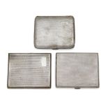 Three 1930s silver cigarette cases, each case of engine turned design with push button thumb