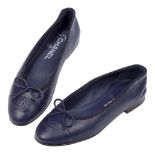 A pair of Chanel lambskin ballet flats, designed in blue with characteristic 'CC' logo to toe,