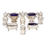 A collection of small silver cruets comprising a pair of star baluster shaped peppers, Birmingham,