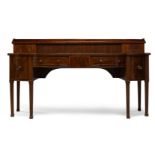 A George III mahogany and crossbanded serving table, the top superstructure, with three quarter