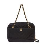 AMENDMENT: Bag interior is stamped '6872871' and has yellow metal and black fabric twin straps not