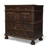A Charles II chest of drawers, with four long drawers applied with geometric moulding, raised on