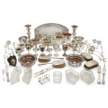 A quantity of silver plate, including: a pair of candlesticks; a small toast rack; a pair of