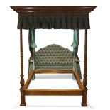 A large double tester bed by Arthur Brett, late 20th Century, the shaped backboard, curtains and