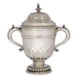 A large Britannia silver twin-handled cup with lid, London, c.1908, Crichton Brothers, raised on a