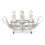 A George III quatrefoil cruet set, London, c.1784, maker's mark WS, the twin handled navette-