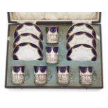 A cased silver mounted Coalport coffee set, early 20th century, comprising six coffee cans and