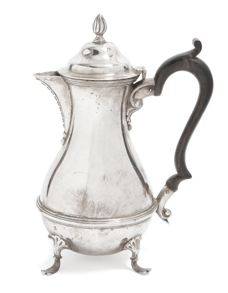 An Edwardian silver coffee pot, London, c.1901, William Hutton & Sons, the rounded body raised on