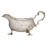 An Edwardian silver sauce boat, Birmingham, c.1908, B&L, the body with engraved armorial raised on