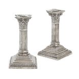 A pair of Victorian silver Corinthian column candlesticks, London, c.1897, Goldsmiths & Silversmiths