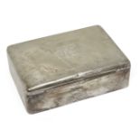 A large Hungarian silver cigarette box, the wood lined interior separated into four compartments,