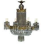 A cut glass and gilt metal eight light chandelier, early to mid 20th Century, the gilt metal