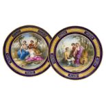 A pair of Vienna porcelain cabinet plates, early 20th century, Ackermann & Fritze, each with figural