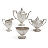 An American silver four-piece tea set comprising teapot, sugar dish, bonbon dish and milk jug, all