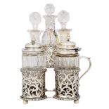 A Victorian silver cinquefoil cruet set, London, c.1861, George Fox, the five cut glass cruets on