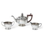 A late George V silver three-piece tea set, Birmingham, c.1933, JW Tiptaft & Son, comprising a tea