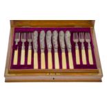 An Edwardian canteen of silver fish knives and forks, London, c.1902, William Hutton & Sons,