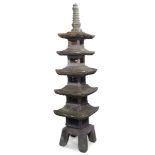 A large modern composite stone pagoda, late 20th Century, with five tiers, on base with splayed