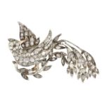An early 20th century diamond bird brooch, the pave set rose and lasque-cut diamond exotic bird