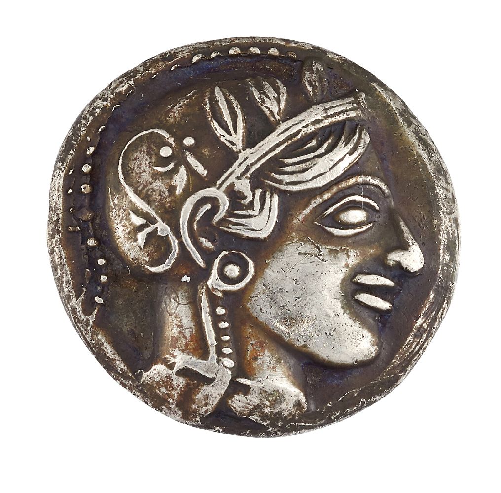 An ancient Greek Attica, Athens silver tetradracham, the obverse with helmeted head of Athena facing