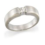 A diamond single stone ring, the princess-cut diamond set within a brushed effect, slightly tapering