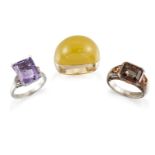 Three gem rings, comprising: a cut-cornered rectangular amethyst single stone with brilliant-cut