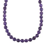 An amethyst bead necklace, composed of a single row of beads, slightly graduating from approximately