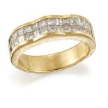 A diamond half-hoop ring, the undulating front composed of two channel-set rows of princess-cut