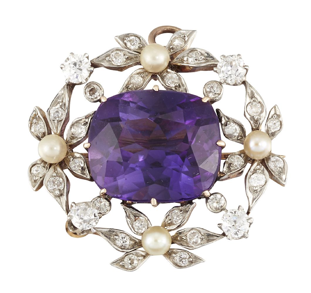 An Edwardian amethyst, diamond and seed pearl brooch, the central cushion shaped mixed cut