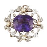 An Edwardian amethyst, diamond and seed pearl brooch, the central cushion shaped mixed cut