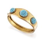 A late Victorian gold and turquoise bangle, the tapered hinged half-hoop set to the front with three