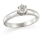 A diamond single stone ring, the brilliant-cut diamond in claw mount to a plain hoop, ring size