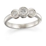 A diamond three stone ring, the three graduated brilliant-cut diamonds in collet mounts, ring size