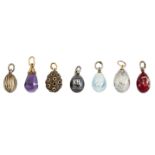 Seven various Imperial Russian silver and gold egg pendants, the designs including an amethyst