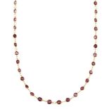 A garnet necklace, composed of a line of circular garnet collets with circular link connections,