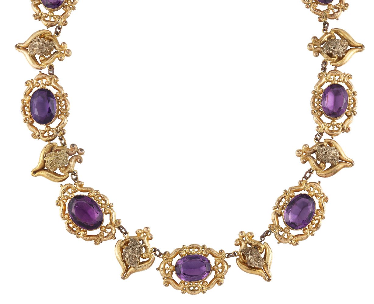 An early Victorian gilt-mounted purple paste necklace, composed of a a series of oval purple