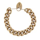 A 9ct gold bracelet, of curb link design, alternate links with scroll decoration to a padlock clasp,